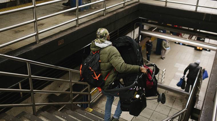 Young mother, hauling child and stroller down subway steps, dies