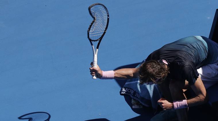 Germany's Alexander Zverev smashes his racket during his fourth round match against Canada's Milos Raonic at the Australian Open tennis championships in Melbourne, Australia