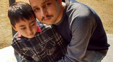 Deputy Superintendent of Police Aman Thakur with his son.