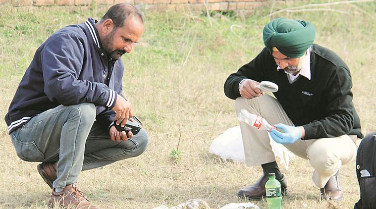 A forensic expert examines the spot where the incident took place, in Ludhiana on Monday. (Express photo/Gurmeet Singh)