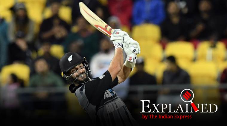 New Zealand's Daryl Mitchell hits out to be caught on the boundary by India's Dinesh Karthik for 8 during the Twenty20 cricket international between New Zealand and India in Wellington, New Zealand, Wednesday, Feb. 6, 2019. (AP Photo/Ross Setford)