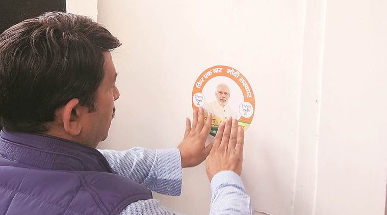 Delhi: With stickers and flags, BJP launches door-to-door drive