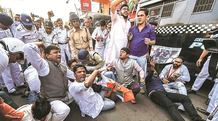 Police detain Youth Congress workers during a protest march against the Centre for alleged misuse of CBI, in Kolkata Monday. PTI