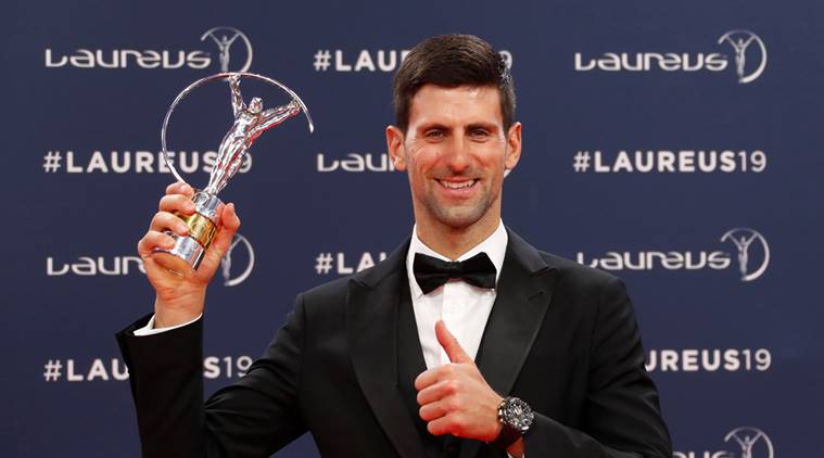 Novak Djokovic poses after winning the sportsman of the year award