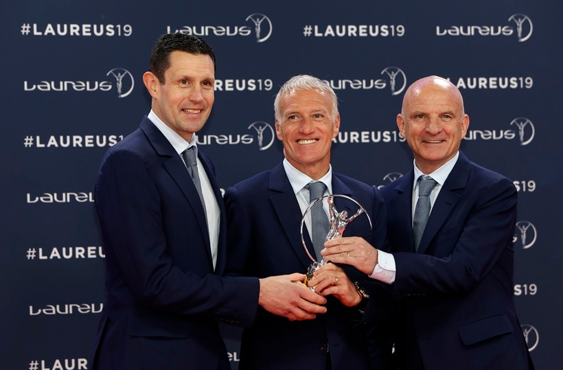 French soccer team head coach Didier Deschamps, center, his goalkeeper coach Franck Raviot and assistant coach Guy Stephanon, right, hold the World team of the year award during the 2019 Laureus World Sports Awards
