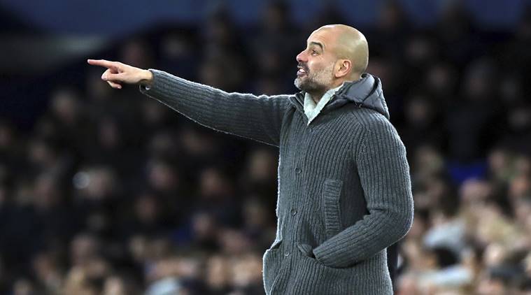 Manchester City manager Pep Guardiola gestures on the touchline during their English Premier League soccer match against Everton at Goodison Park, Liverpool, England