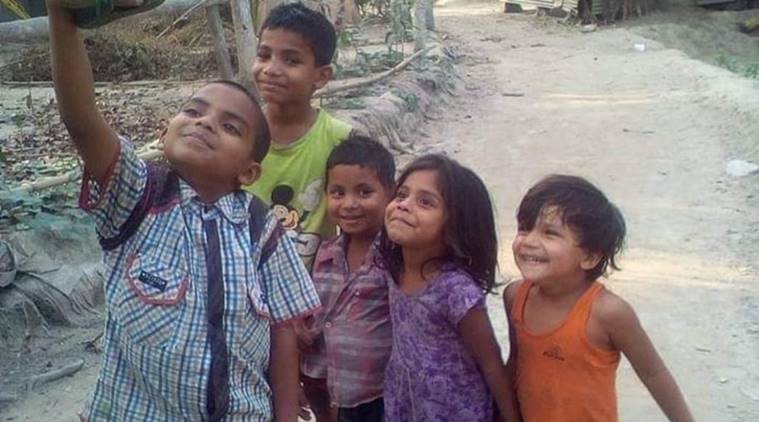 This viral picture of children clicking selfie is breaking hearts