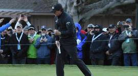 Phil Mickelson celebrates his birdie at the 15th hole during the final round of the AT&T Pebble Beach Pro-Am golf tournament at Pebble Beach Golf Links.