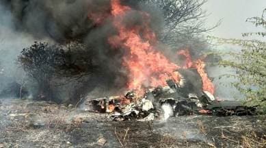 Smoke and fire billow after an Indian Air Force's Mirage 2000 trainer aircraft crashed in the southern city of Bengaluru on Friday. (Reuters)