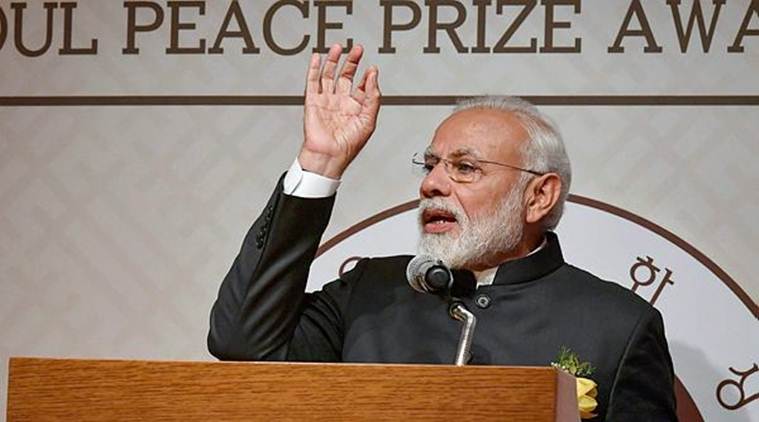 Prime Minister Narendra Modi addresses the crowd after receiving the Seoul Peace Prize at the award ceremony in Seoul on Friday. (PIB/PTI)