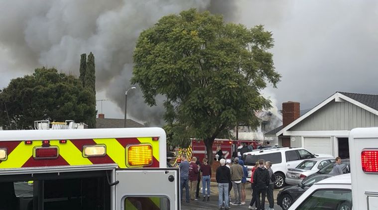 Image result for Plane crashes in California, houses burn