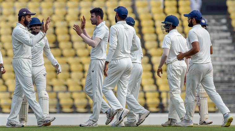 Vidarbha off-spinner Akshay Wakhare celebrates with his teammates the dismissal of Saurashtra batsman Prerak Mankad on the final day of the Ranji Trophy cricket match, in Nagpur