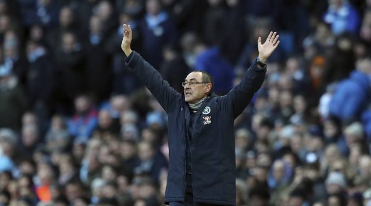 Chelsea manager Maurizio Sarri gives instructions to his players during the English Premier League soccer match between Manchester City and Chelsea at Etihad stadium in Manchester, England
