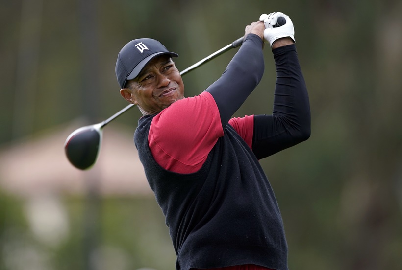 Tiger Woods tees off on the 17th hole during the final round of the Genesis Open golf tournament at Riviera Country Club on Sunday