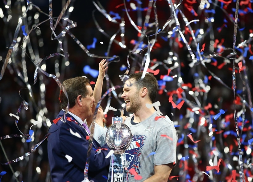 New England Patriots quarterback Tom Brady is interviewed by CBS host Jim Nantz with the Vince Lombardi Trophy after defeating the Los Angeles Rams in Super Bowl LIII at Mercedes-Benz Stadium.