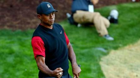 FILE PHOTO: Nov 23, 2018; Las Vegas, NV, USA; Tiger Woods reacts to chipping in for birdie on the 17th hole during The Match: Tiger vs Phil golf match at Shadow Creek Golf Course. Mandatory Credit: Rob Schumacher/File Photo