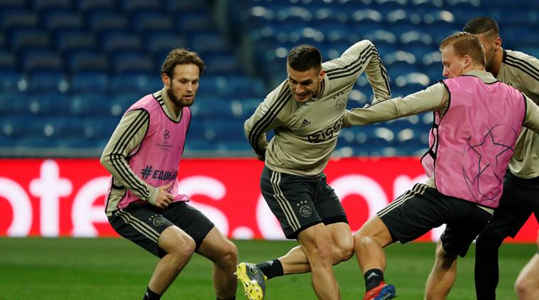 Ajax Amsterdam's Dusan Tadic and Daley Blind during training