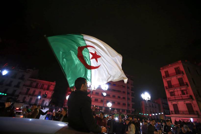 Algerian protestors celebrate as President Abdelaziz Bouteflika announces he won't seek another term