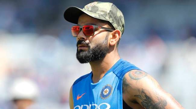 India's captain Virat Kohli sports a camouflage cap before the start of the third one day international cricket match between India and Australia in Ranchi, India, Friday, March 8, 2019. Members and the support staff of Indian cricket team wore camouflage caps as a mark of tribute to the paramilitary soldiers killed in suicide car bombing in Indian controlled Kashmir last month. (AP Photo/Aijaz Rahi)