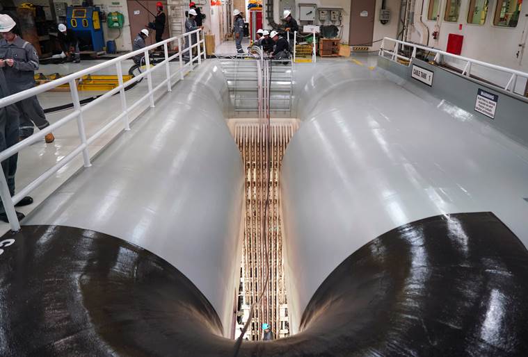 Fiber-optic cable is loaded into storage tanks