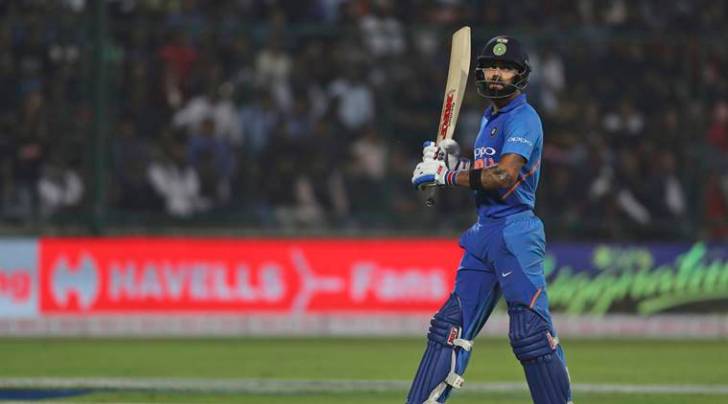 India's captain Virat Kohli walks back to the pavilion after being dismissed during the final one day international cricket match between India and Australia in New Delhi