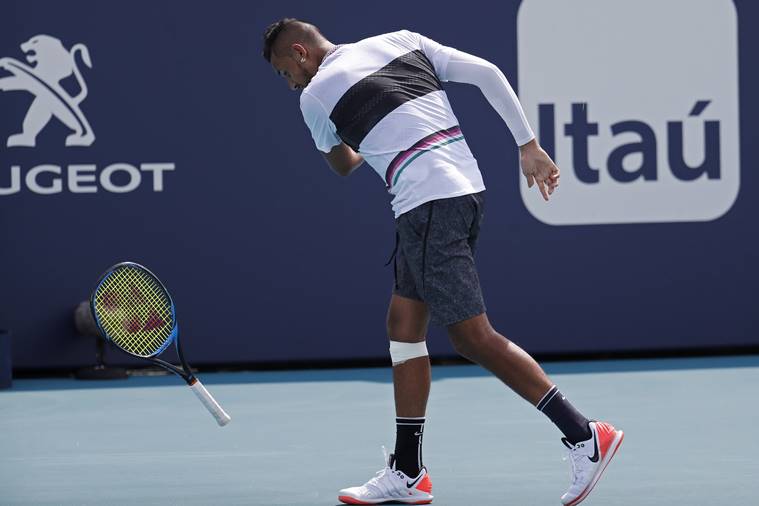 Nick Kyrgios of Australia smashes his racquet after missing a shot against Borna Coric of Croatia (not pictured) in the fourth round of the Miami Open at Miami Open Tennis Complex.