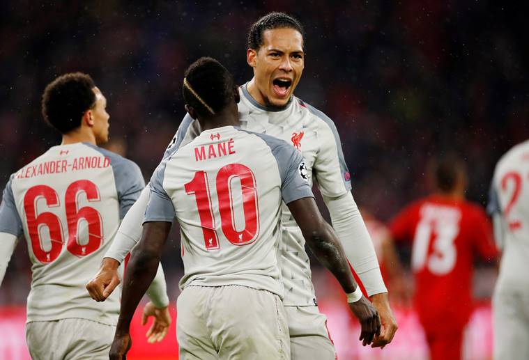 Liverpool's Sadio Mane celebrates scoring their third goal with Virgil van Dijk.