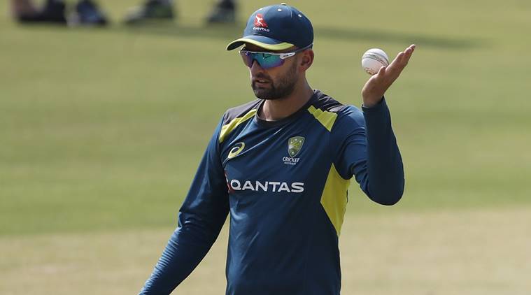 Australia's Nathan Lyon prepares to bowl in the nets during a training session on the eve of their second T20 international cricket match against India in Bangalore, India