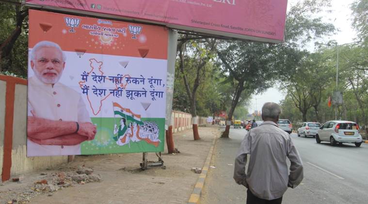 Various hoardings with messages such as "Modi hai toh mumkin hai" (If Modi is there, it is possible) were set up across Ahmedabad. (Express photo/Javed Raja)