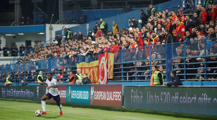 England's Raheem Sterling and Montenegro fans during the match