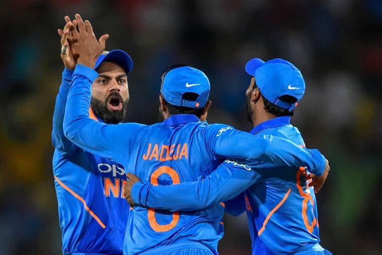India's Ravindra Jadeja, Kedar Jadhav and Virat Kohli celebrate the dismissal of Australia's Peter Handscomb during the 2nd ODI cricket match at Vidarbha Cricket Association Stadium, in Nagpur