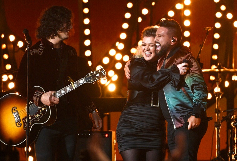 Dan Smyers, left, and Shay Mooney, right, of Dan + Shay performance