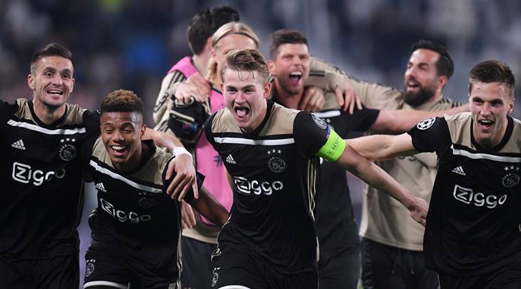 Ajax's Dusan Tadic, David Neres and Matthijs de Ligt celebrate after the match