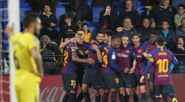 Barcelona forward Luis Suarez celebrates with teammates after scoring his side's fourth goal during the Spanish La Liga soccer match between Villarreal and FC Barcelona at the Ceramica stadium in Villarreal, Spain