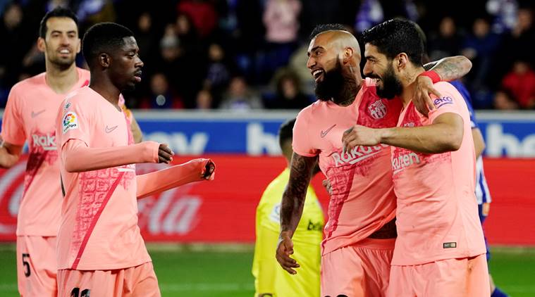 Barcelona's Luis Suarez celebrates scoring their second goal with team mates