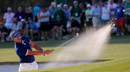 Brooks Koepka of the U.S. hits from a sand trap on the 18th hole during first round play of the 2019 Masters golf tournament at Augusta National Golf Club in Augusta, Georgia, U.S., April 11, 2019. REUTERS/Brian Snyder