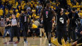 LA Clippers forward Montrezl Harrell (5) and guard Patrick Beverley (21) celebrate after game two of the first round of the 2019 NBA Playoffs against the Golden State Warriors at Oracle Arena.