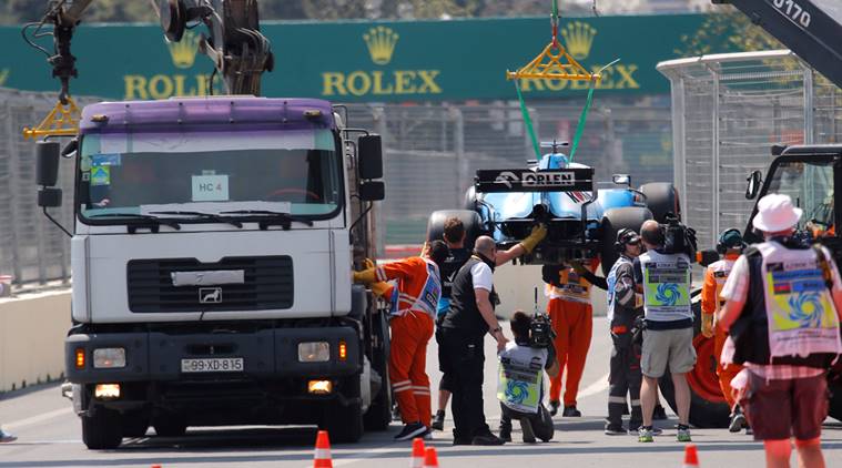 George Russell's Williams F1 car is recovered after stopping on track.