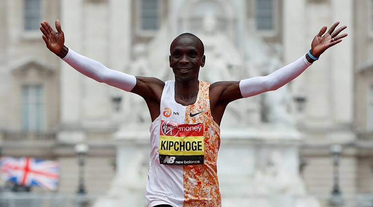 Kenya's Eliud Kipchoge celebrates winning the London Marathon men's elite race