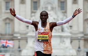 Kenya's Eliud Kipchoge celebrates winning the London Marathon men's elite race