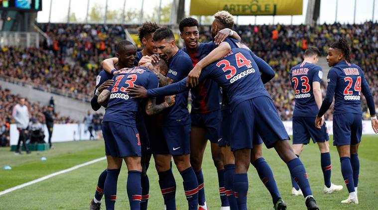 Paris St Germain's Dani Alves celebrates scoring their first goal with team mates