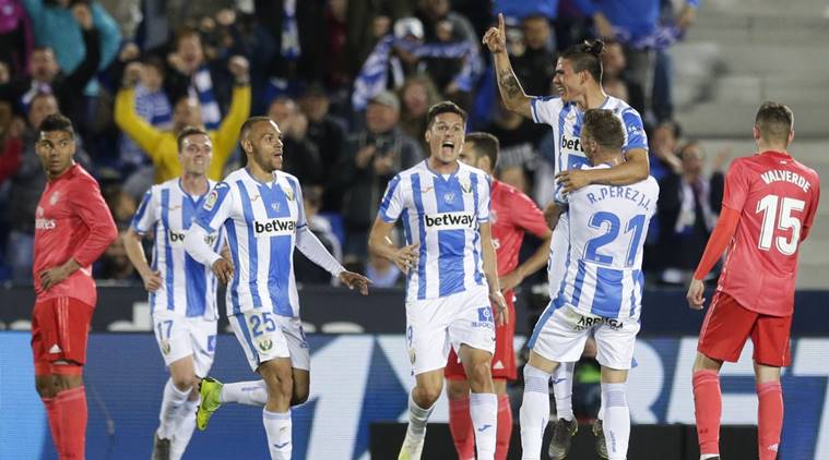 Leganes players celebrate after scoring against Madrid during a Spanish La Liga soccer match in Leganes, outskirts Madrid, Spain
