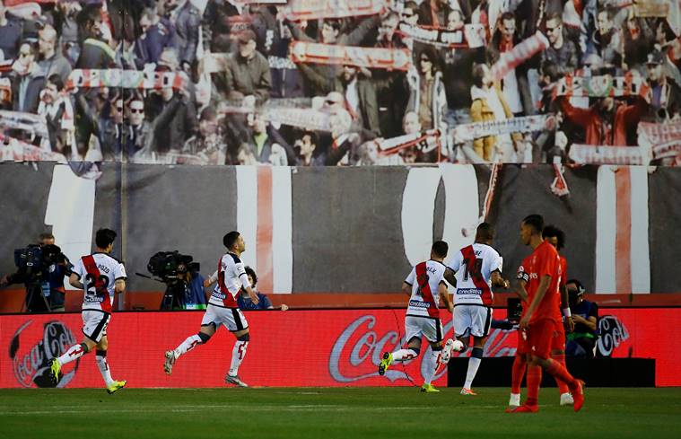 Rayo Vallecano players celebrate scoring against Real Madrid