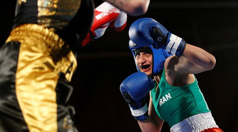 Iranian boxer Sadaf Khadem in action against French boxer Anne Chauvin during an official boxing bout in Royan, France.