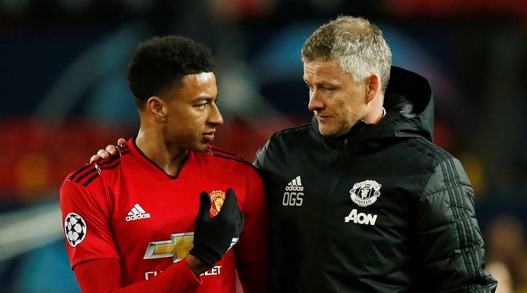 Manchester United manager Ole Gunnar Solskjaer and Manchester United's Jesse Lingard react after the match against Juventus