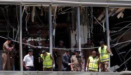 Crime scene officials inspect the explosion area at Shangri-La hotel in Colombo no alt set
