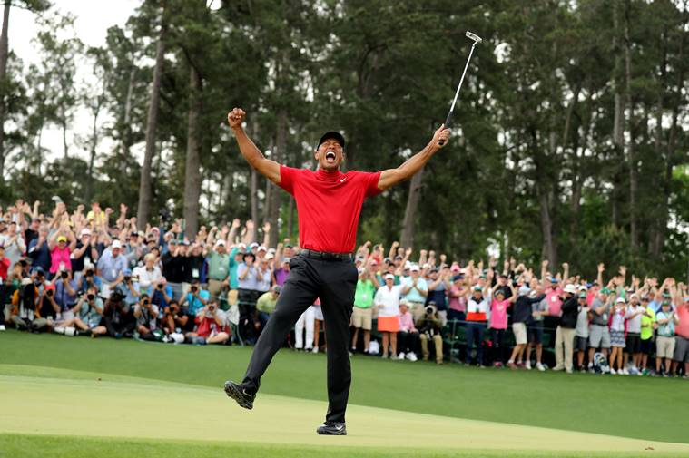 Tiger Woods of the U.S. celebrates on the 18th hole after winning the 2019 Masters.