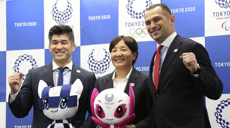 Men's Judo Japan national team head coach Kosei Inoue, Women's Softball Japan national team head coach Reika Utsugi and Tokyo 2020 Sports Director Koji Murofushi pose for a photo after a press conference to unveil detailed Olympic competition schedule in Tokyo