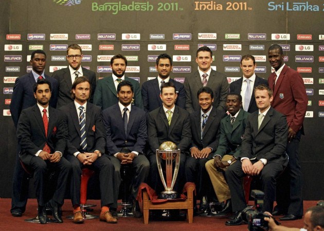 14 national captains, front l-R, Canada's Ashish Bagai, Netherlands Peter Borren, Sri Lanka Kumar Sangakkara, Australia's Ricky Ponting, Bangladesh's Shakib Al Hasan, Kenya's Jimmy Kamande and Ireland William Porterfield, (Back Row L-R) Zimbabwe's Elton Chigumbura, New Zealand's Daniel Vettori, Pakistan Shahid Afridi, India's Mahendra Singh Dhoni, South Africa's Graeme Smith, England's Andrew Strauss and West Indies Darren Sammy posing with the ICC Cricket World Cup trophy in Dhaka, Bangladesh