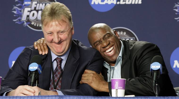 In this Monday, April 6, 2009 file photo, former NBA players Earvin "Magic" Johnson, right, and Larry Bird share a laugh at a news conference before the championship game between Michigan State and North Carolina at the men's NCAA Final Four college basketball tournament in Detroit.